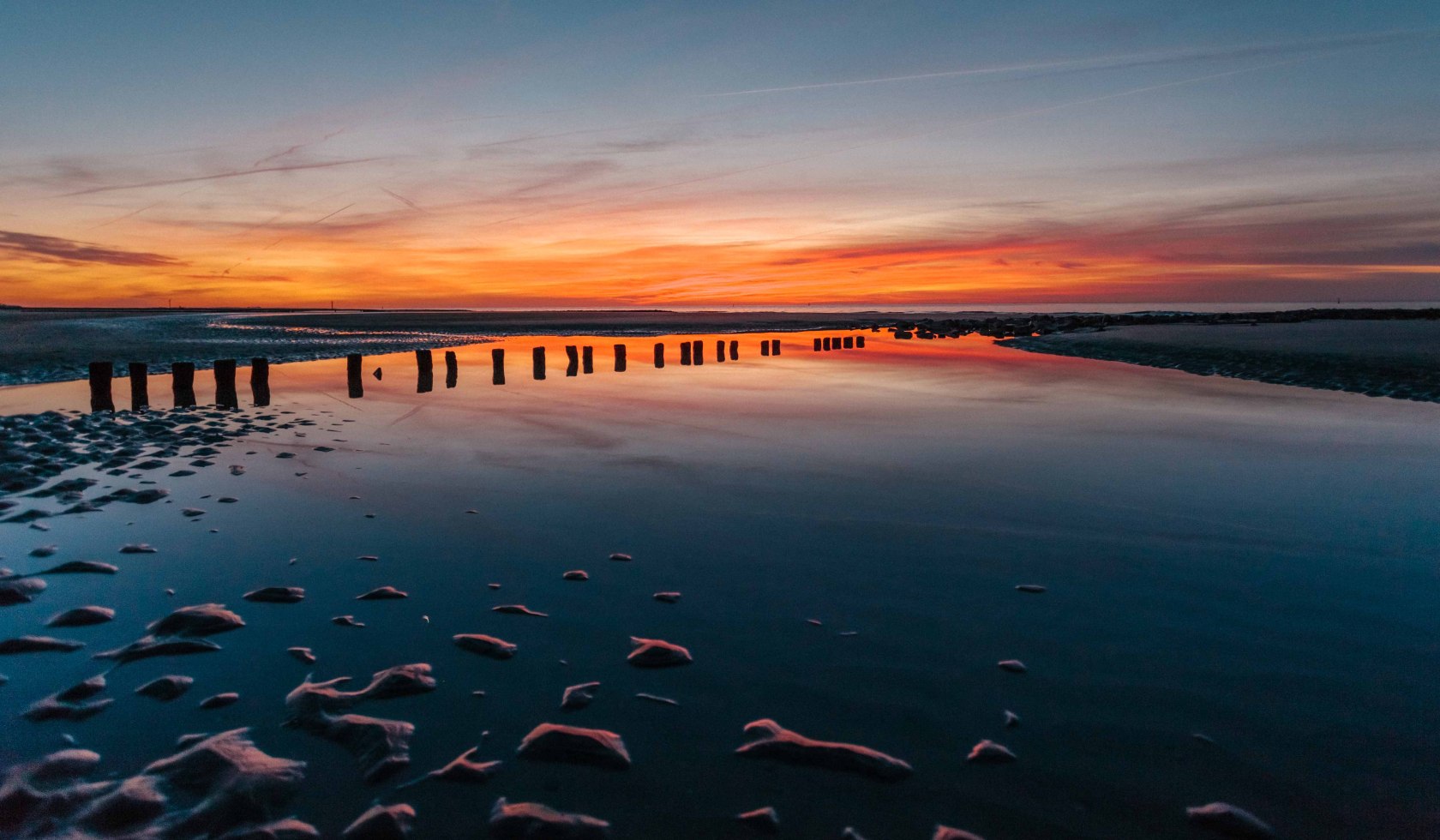 Zonsondergang in de Waddenzee voor Norderney, © Janis Meyer